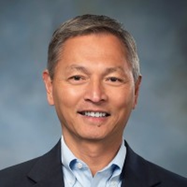 Wayne Meng in a formal business portrait