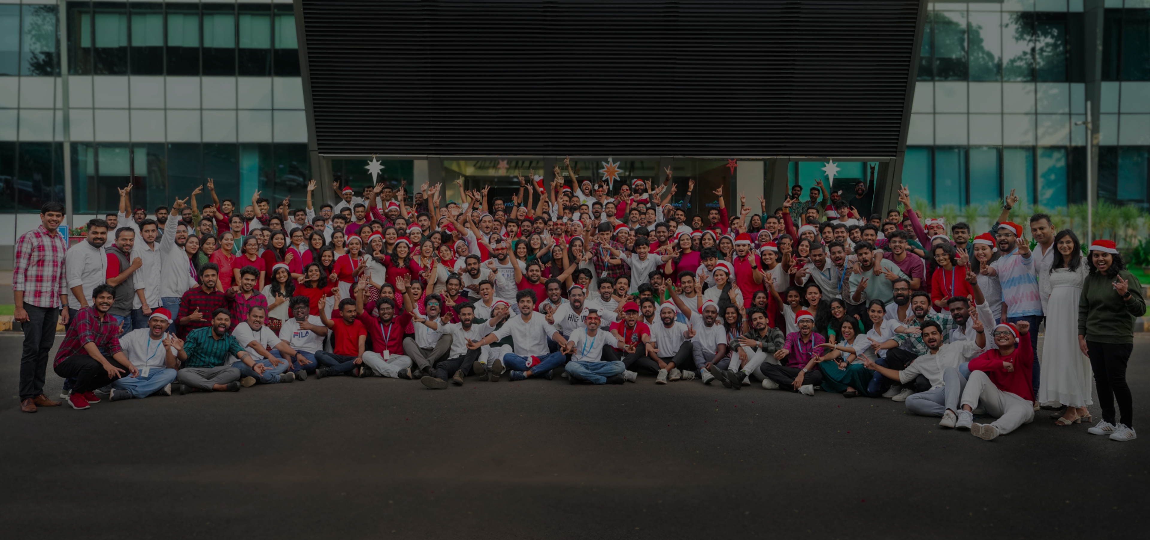 Webandcrafts team gathered outside their workplace for a Christmas celebration