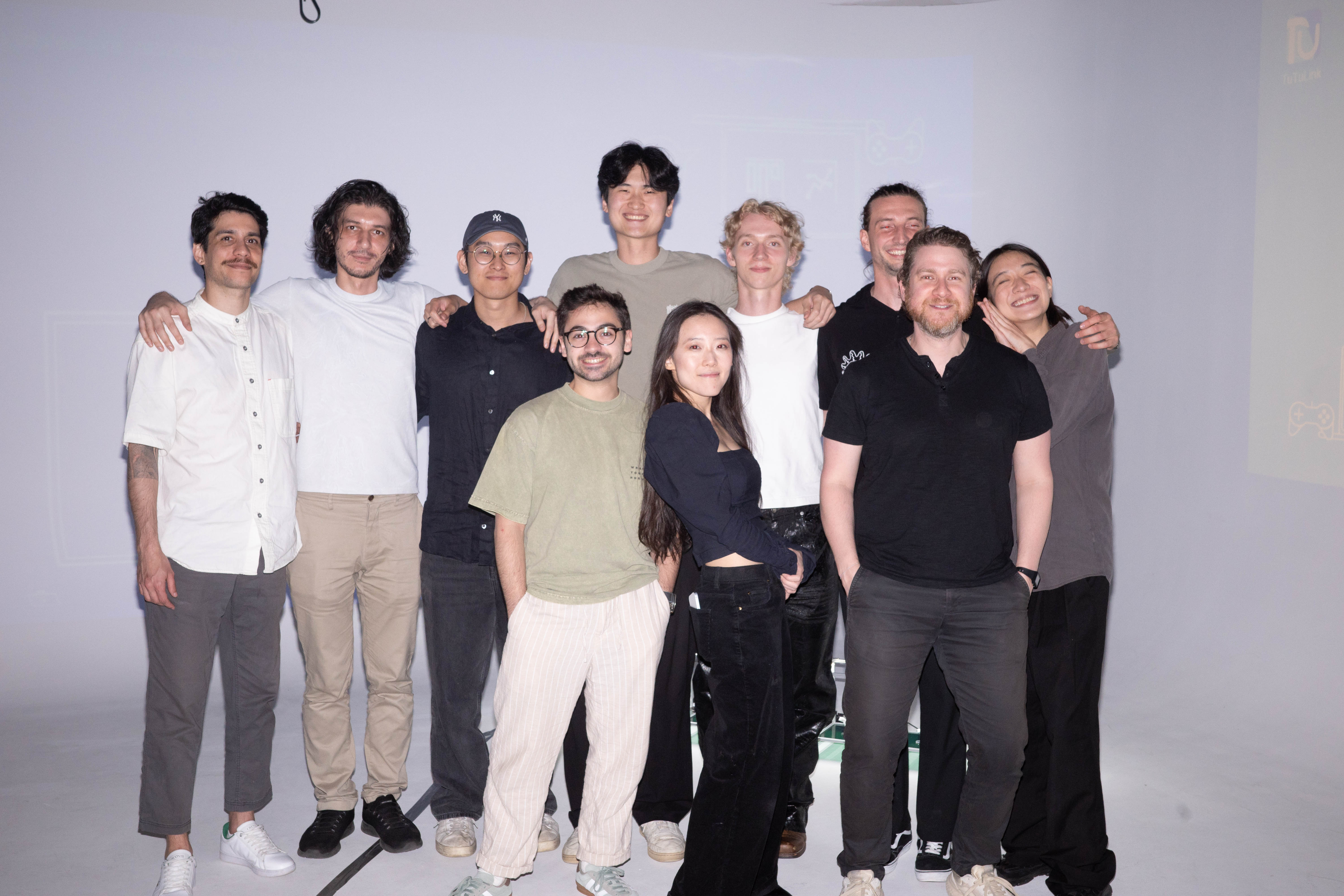 Weber Wong, in a navy baseball cap, standing with members of the FLORA team