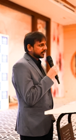 WebKorps founder Chirag Agrawal speaking into a microphone