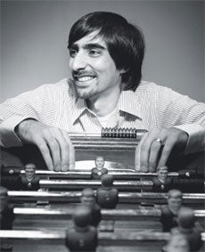 Webs co-founder Haroon Mokhtarzada leaning over a foosball table