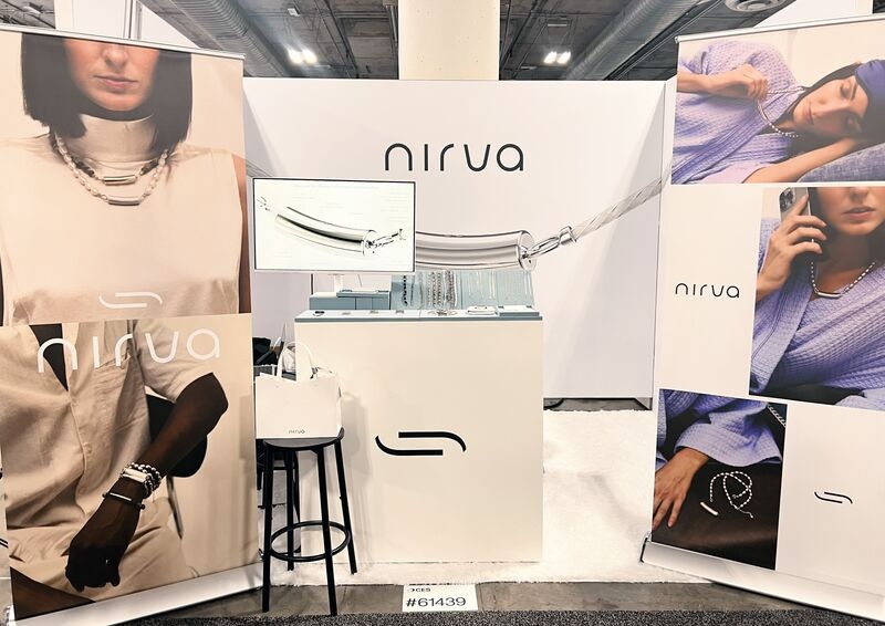 Nirva’s CES booth, with jewelry displays and fashion photographs