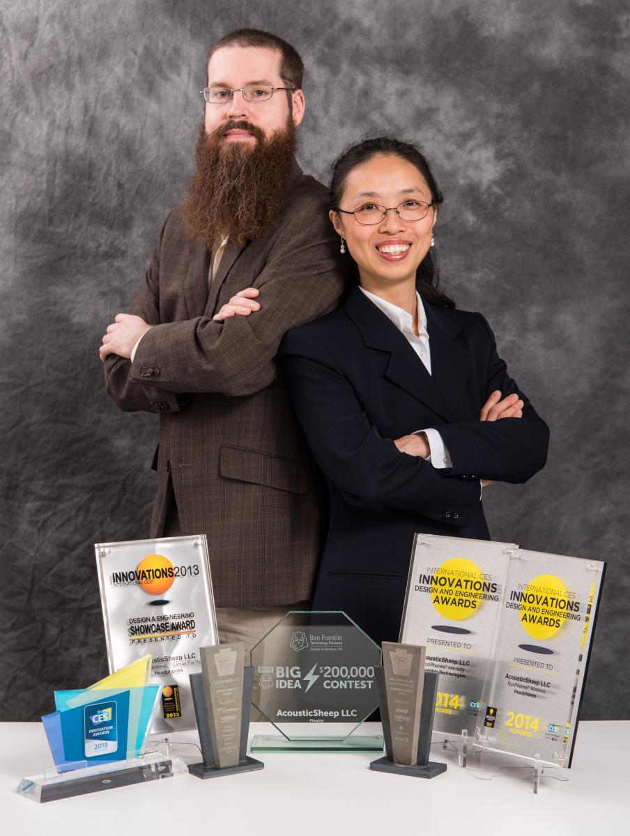 Jason Wolfe and Wei-Shin Lai standing together behind AcousticSheep design and business awards