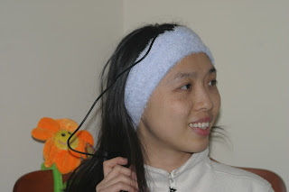 Wei-Shin Lai wearing an early SleepPhones prototype with visible wires