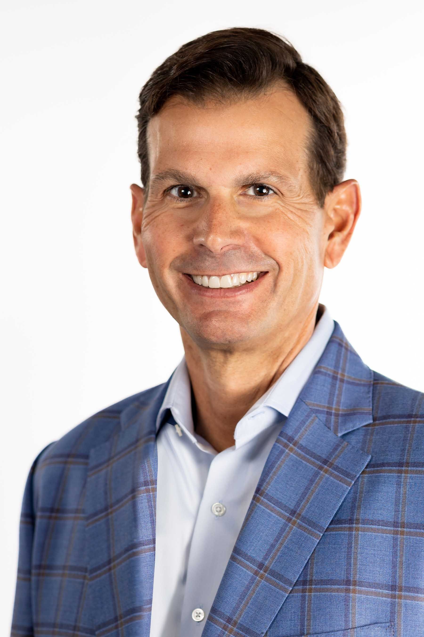 Wellfit CEO Fulton Collins in a blue checked jacket