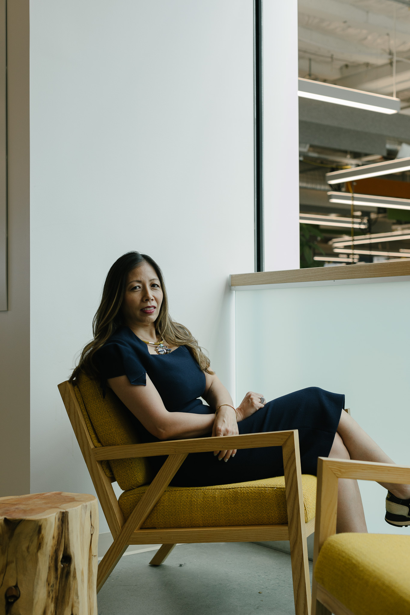 Wendy Tan White seated in an armchair at Intrinsic’s Mountain View offices