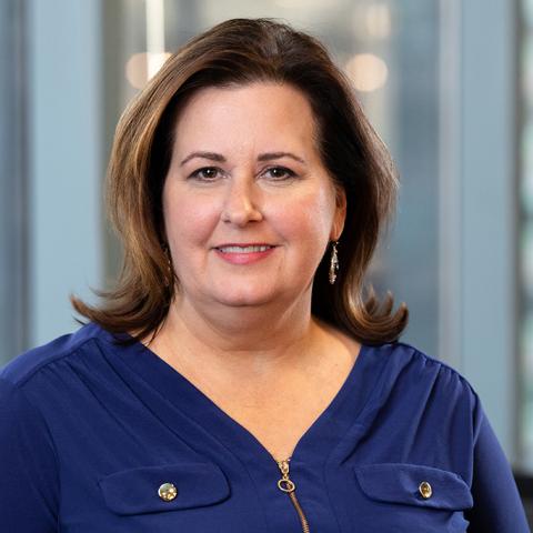 Wendy White in a blue blouse, photographed for a UC Davis alumni profile