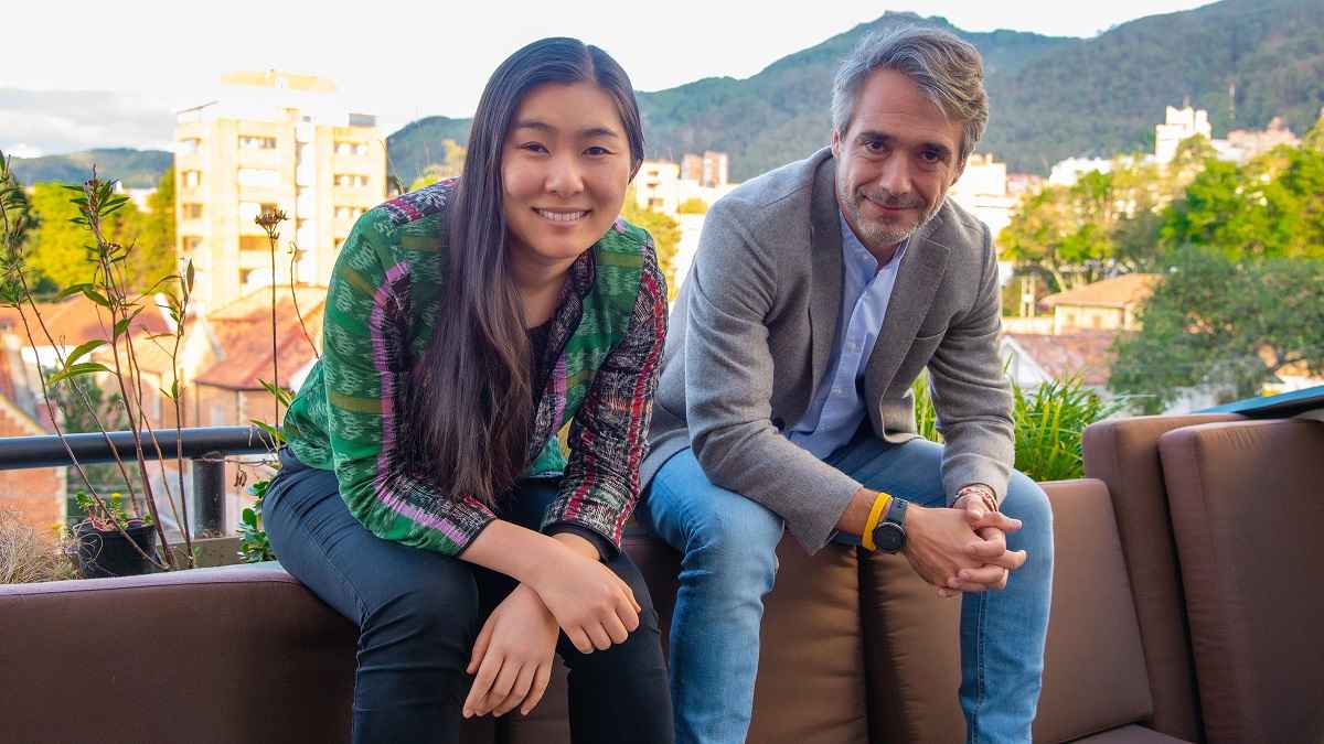 Wenyi Cai and Polymath co-founder Carlos Fernández de la Pradilla seated together outdoors