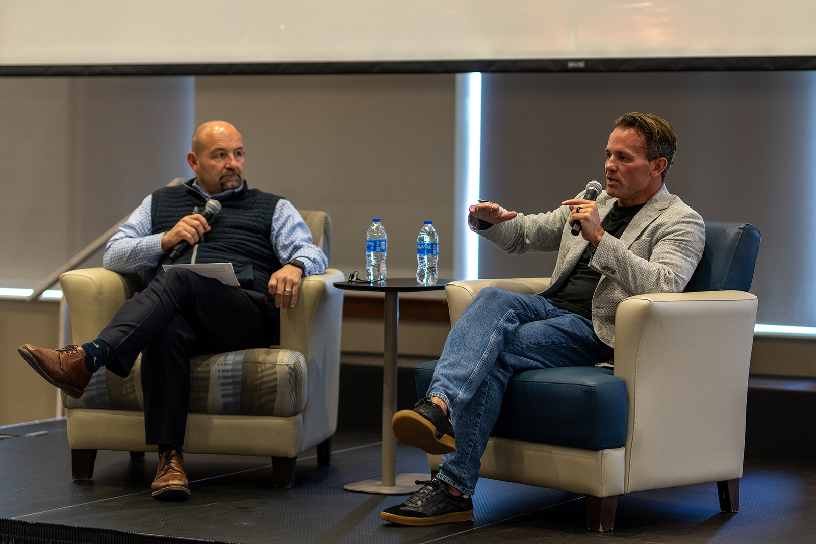 Wes Cummins, right, speaking beside Minnkota CEO Mac McLennan at a fireside discussion