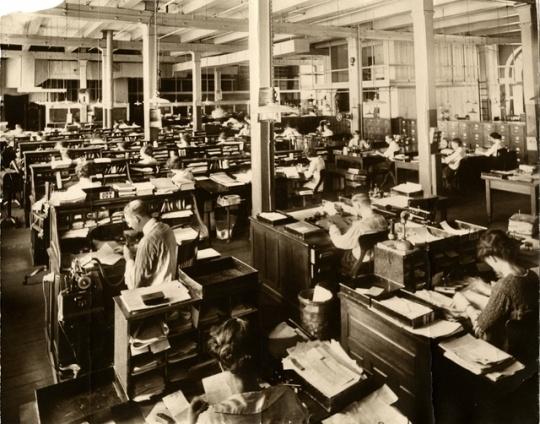 Rows of desks in West Publishing editorial offices around the 1920s