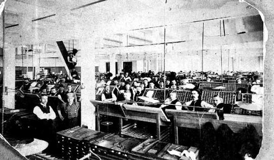 Typesetters working inside West Publishing in 1885