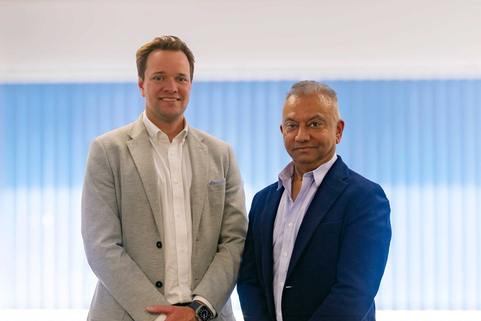 Westcoast executives Phil Bell and Sunil Madhani standing together