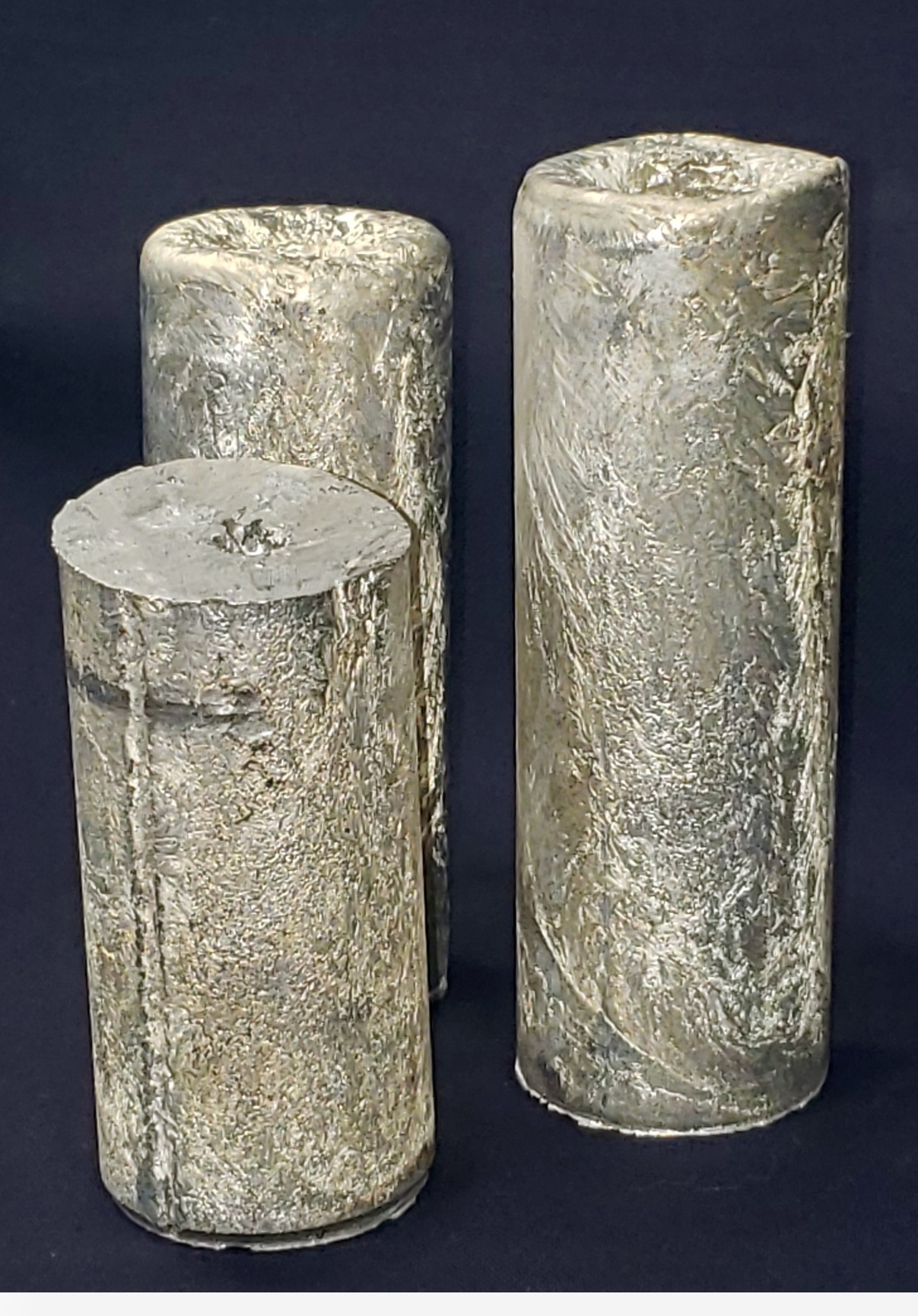 Three rough cylinders of magnesium metal from Western Magnesium’s pilot plant, pictured in its June 2022 announcement