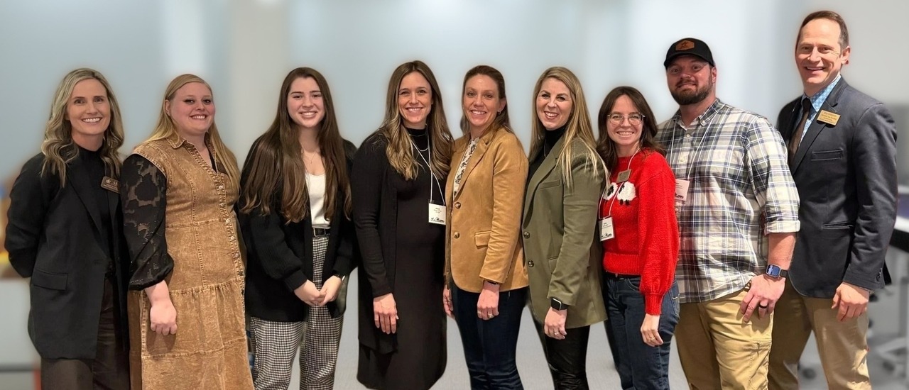 A Western Skies Strategies group poses together at a professional gathering