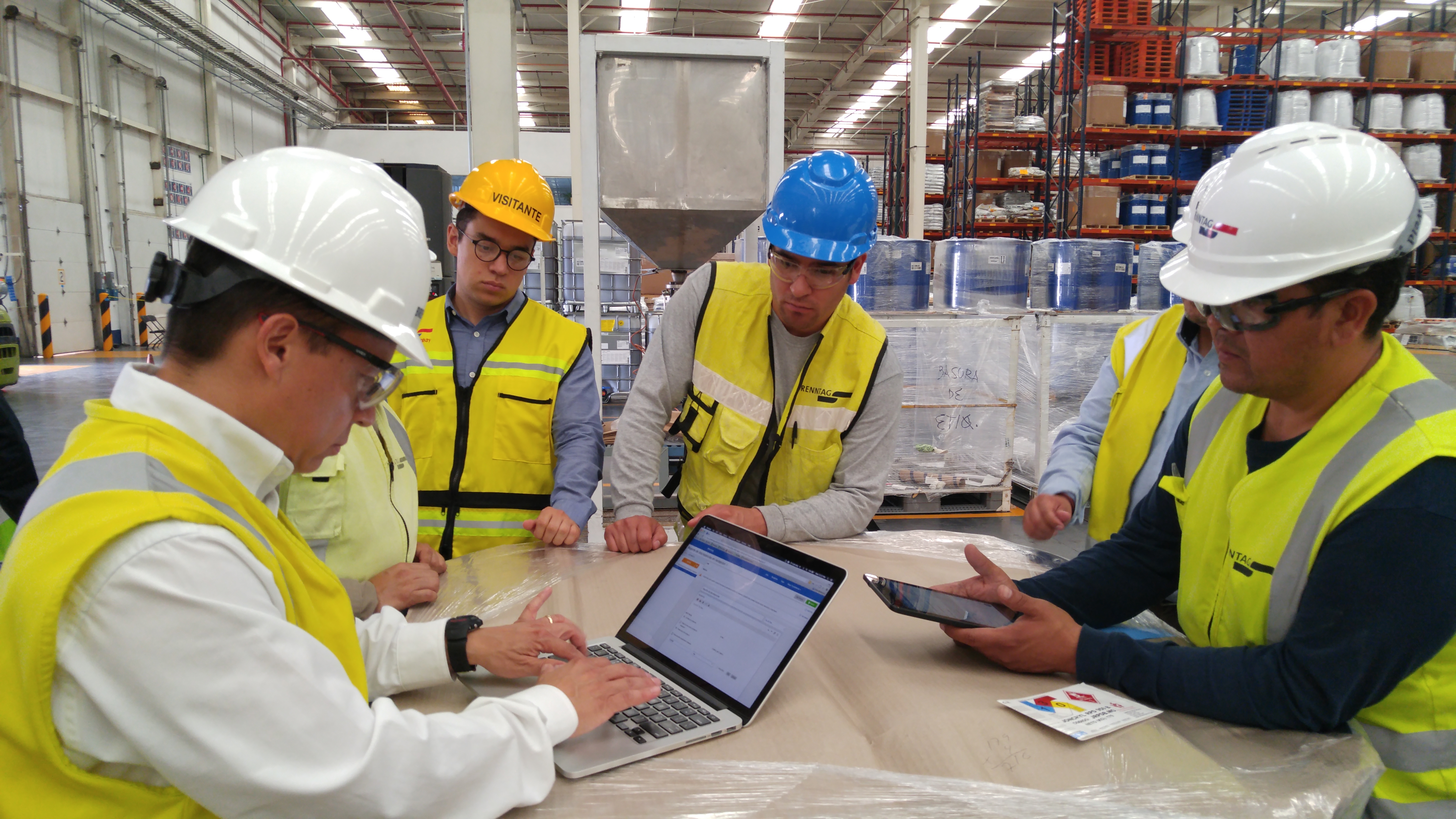 Industrial worker with a mobile device on a warehouse floor, photographed for 2016 Parsable coverage
