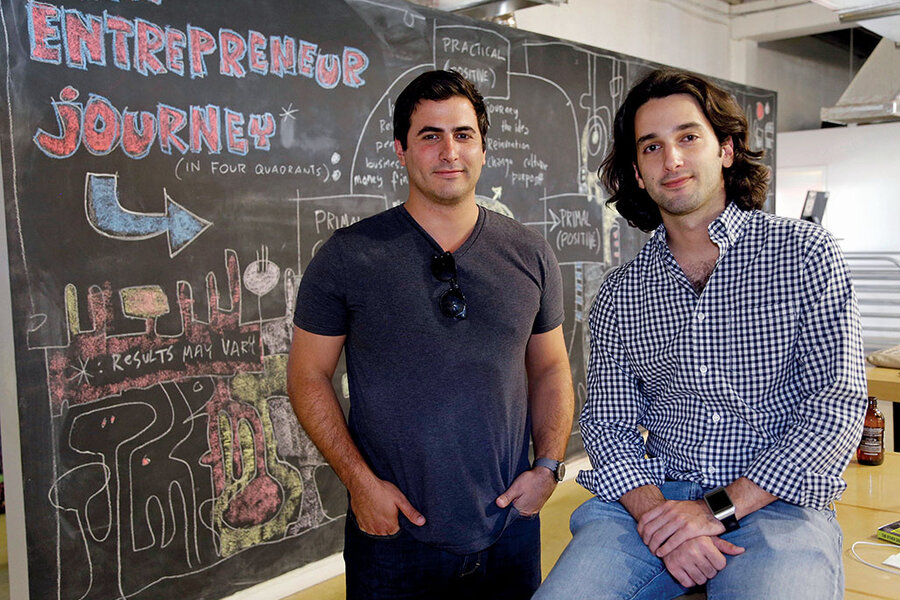 Wifredo Fernandez, left, and Daniel Lafuente at The LAB Miami in front of a chalkboard about the entrepreneur journey.