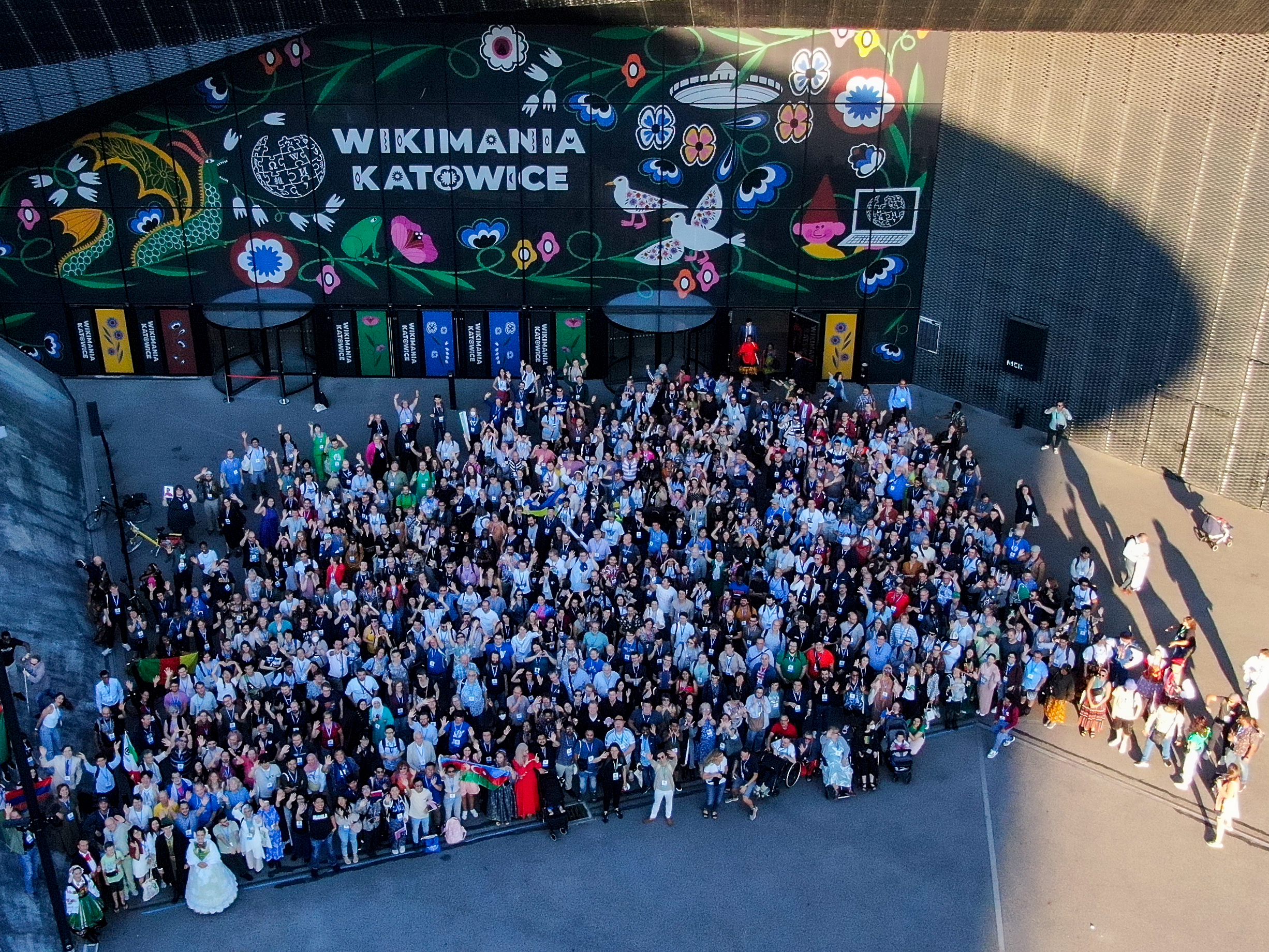 Wikimania participants gathered outside the International Congress Centre in Katowice, Poland, in 2024