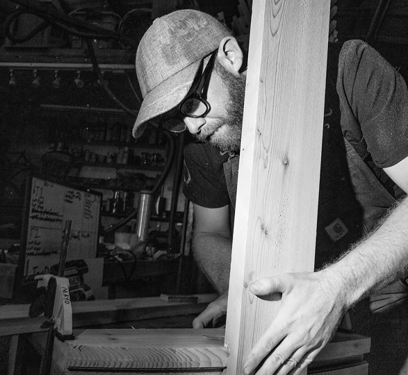 Will Mayo working on a wooden component in the Nordsprings workshop