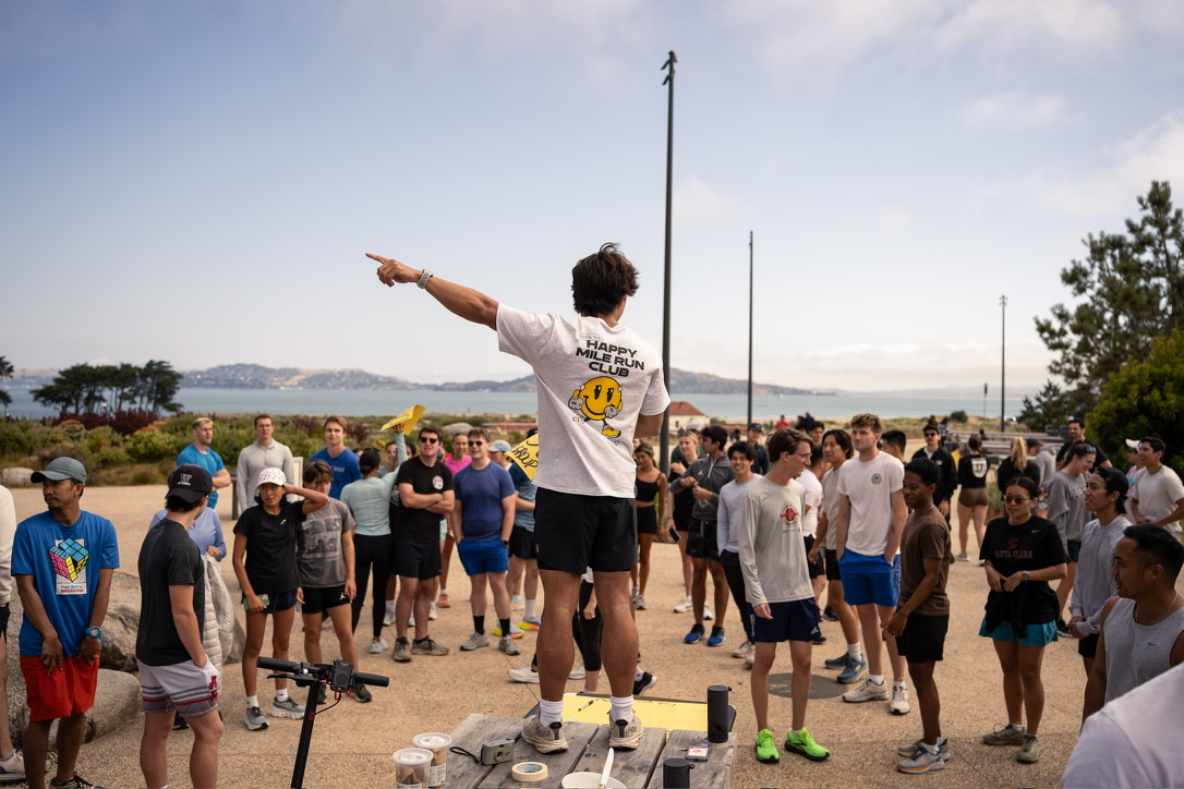 William Armstrong addresses members of Happy Mile Run Club at a waterfront gathering