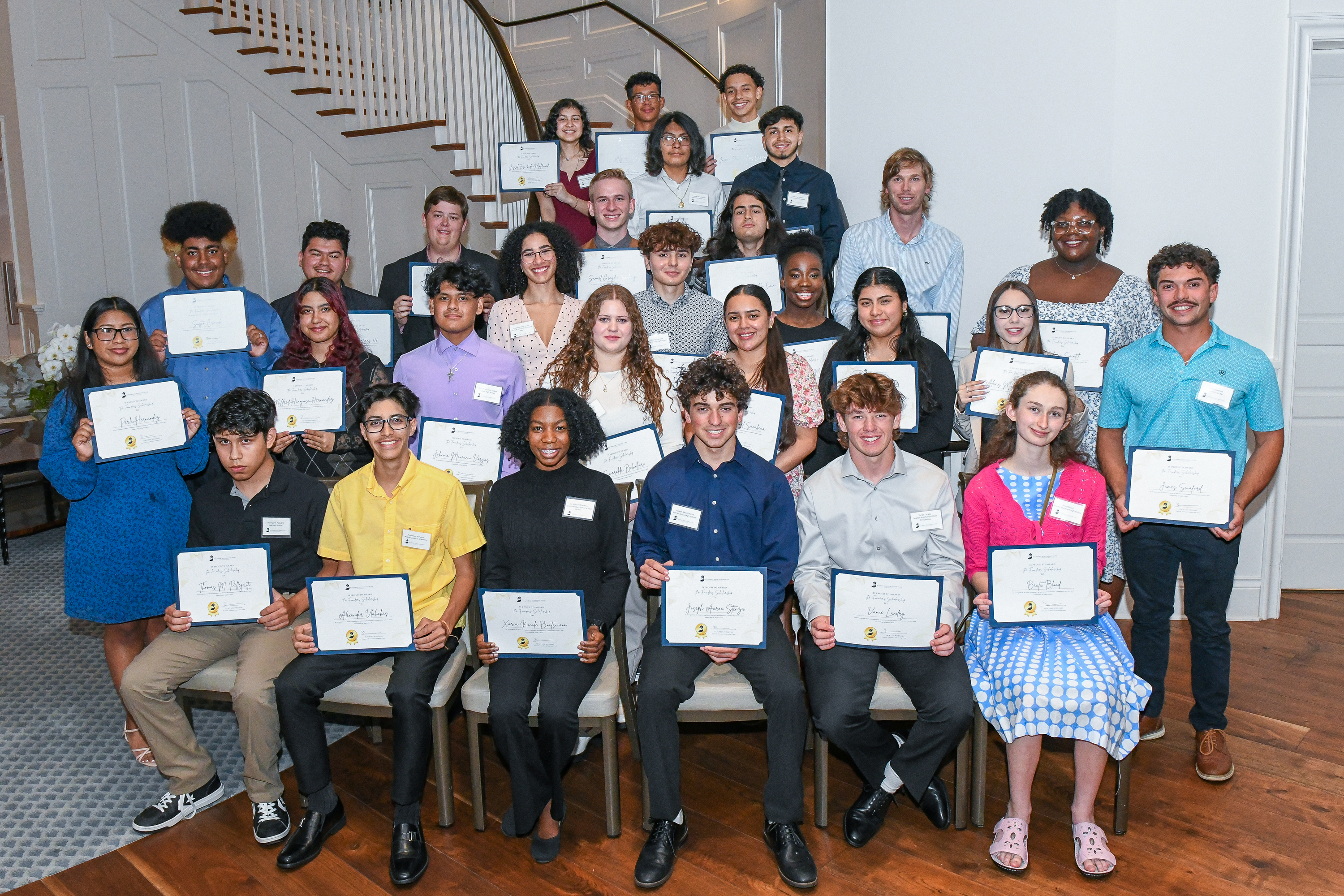 Founders Scholarship Fund recipients holding their award certificates in 2024