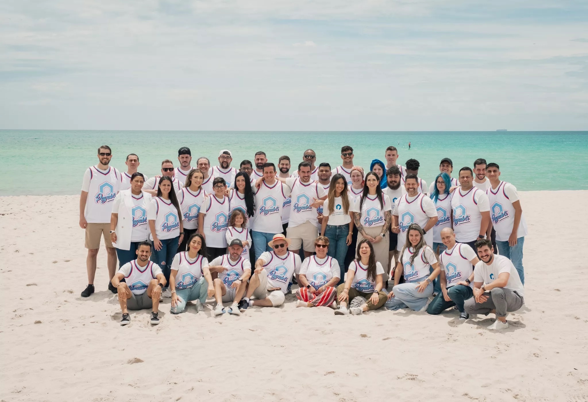 Payabli colleagues gathered outdoors for a team photograph