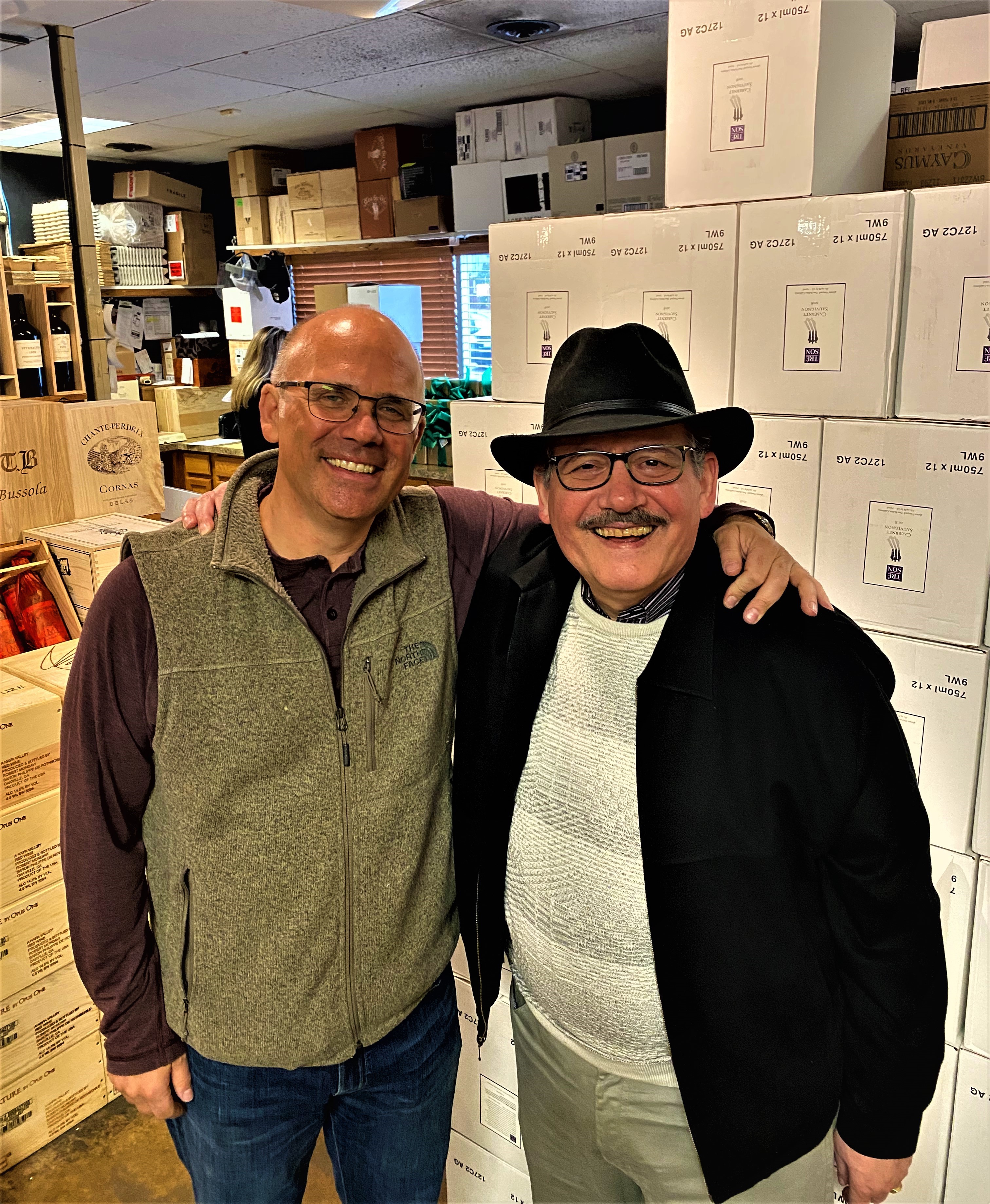 Willie Newman, left, smiling alongside The Wine Raconteur in a Livonia wine shop