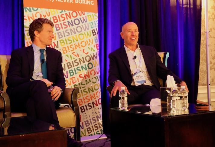 Willy Walker, left, and Barry Sternlicht seated onstage at a Bisnow event