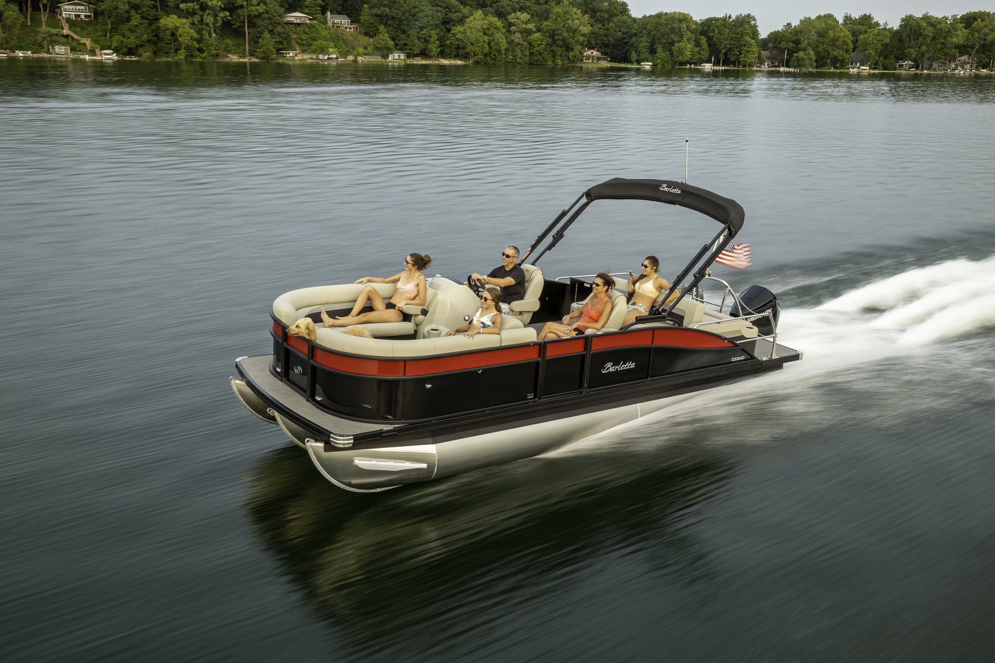 A Barletta pontoon boat cruising across open water
