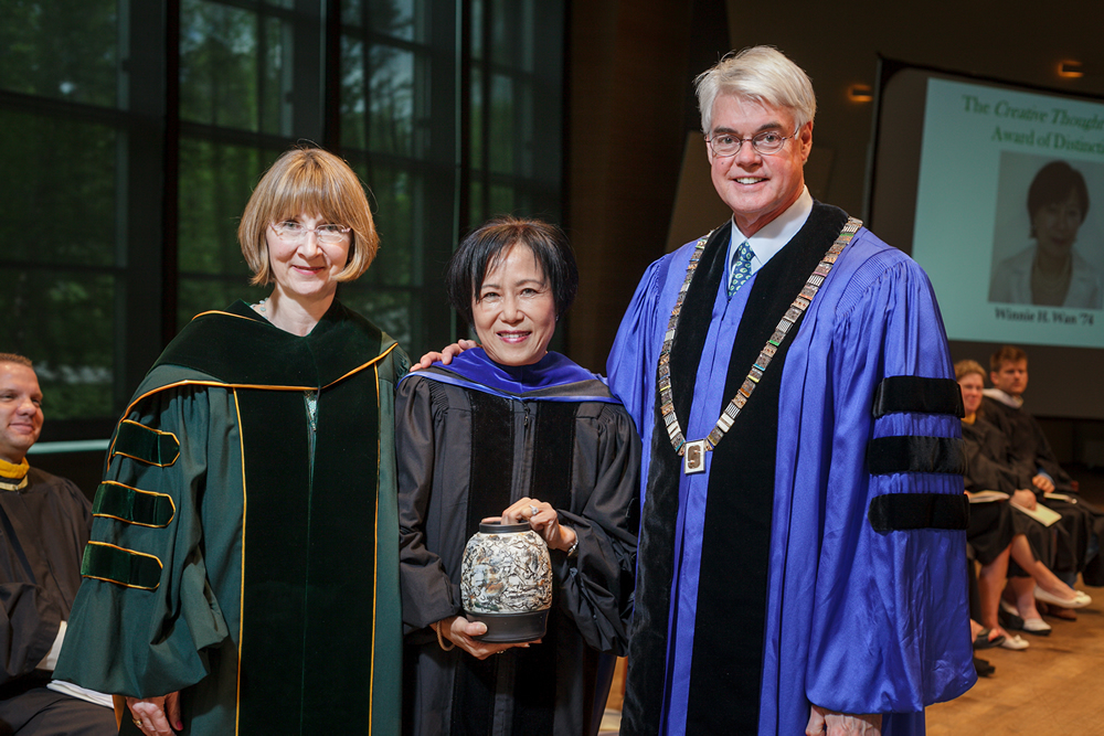 Winnie Wan, center, receiving her 2014 award with Gail Dudack and Philip A. Glotzbach at Skidmore