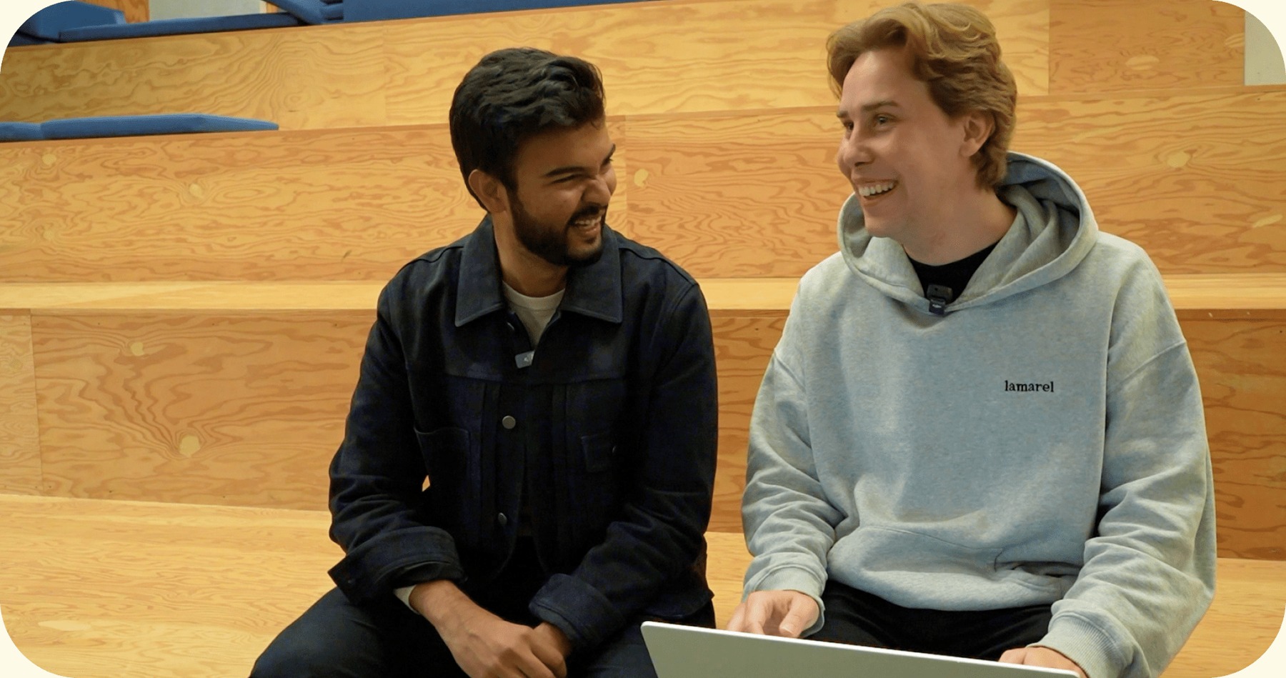 Wispr CEO Tanay Kothari and Yapify CEO Dan Meier talking together with a laptop