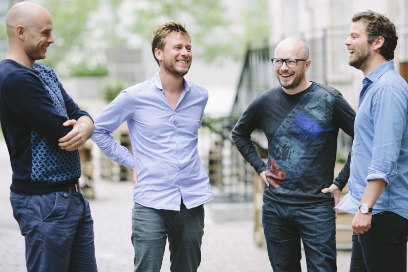Peakon's four founders standing together outdoors