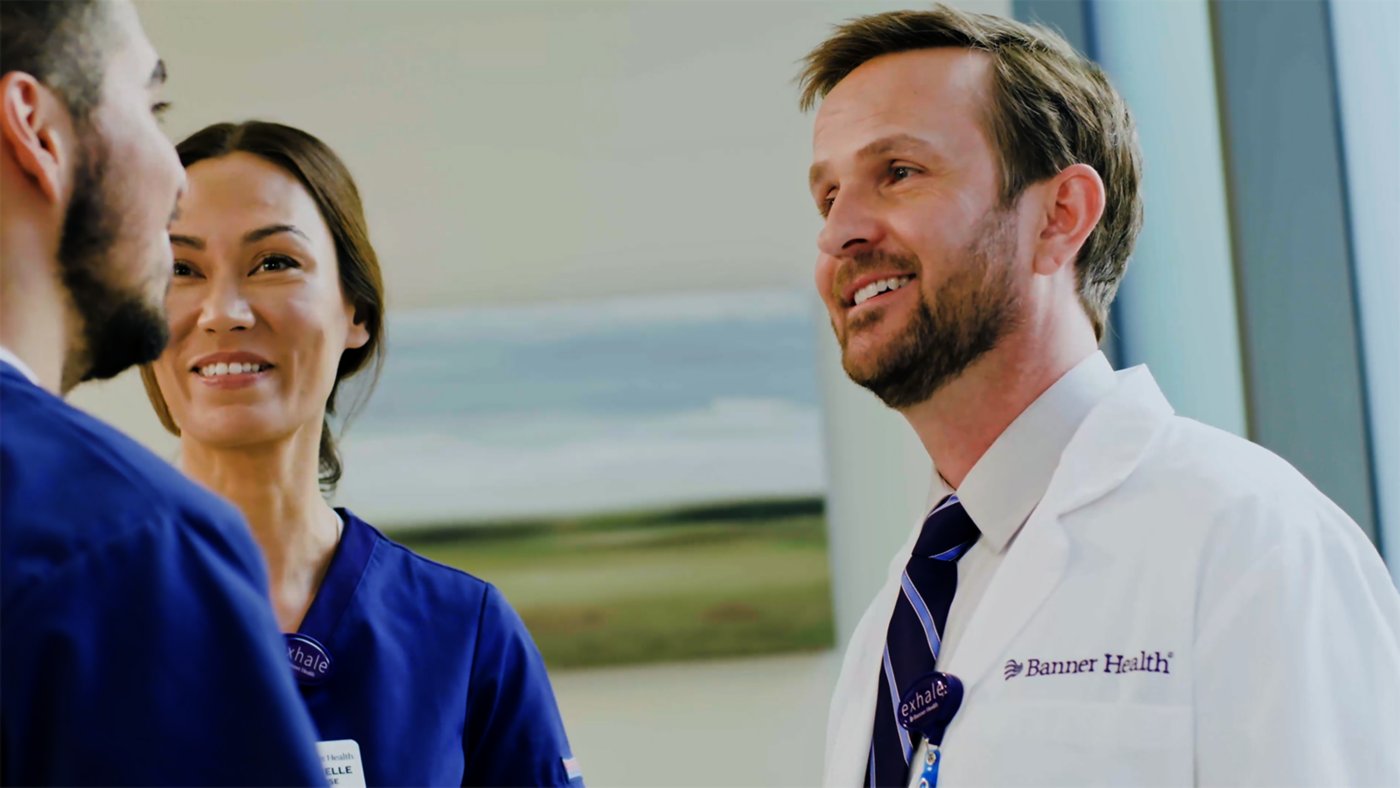 Banner Health clinicians speaking in a hospital setting