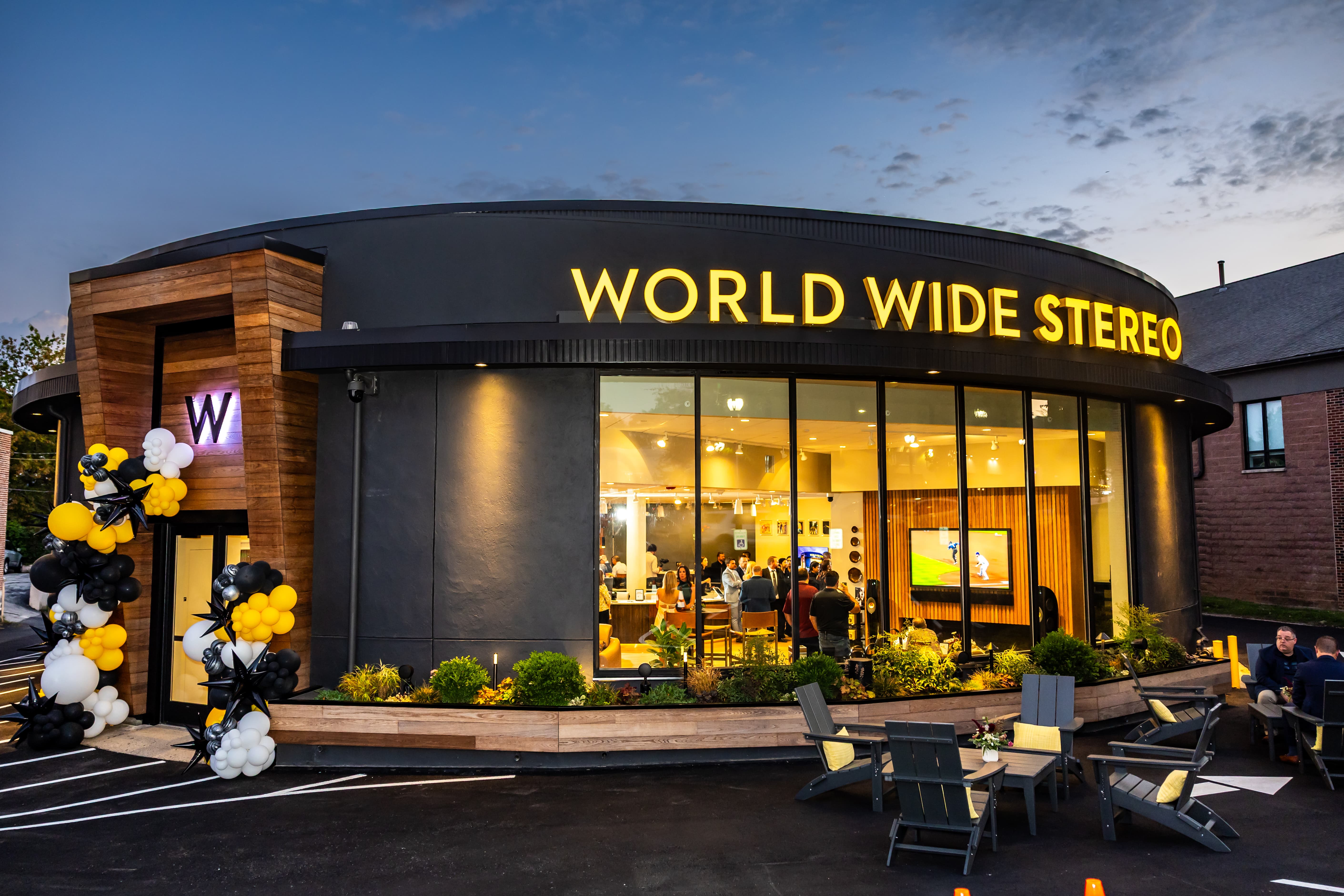 Guests exploring World Wide Stereo's Wayne Experience Center during its grand opening
