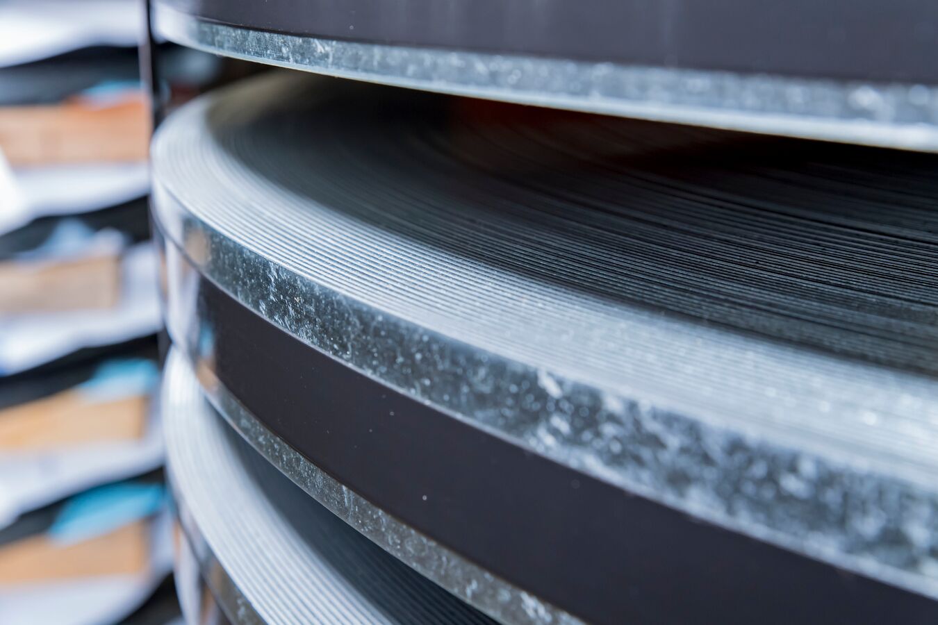 Close view of banded, slit steel coils stacked at a Worthington Steel facility