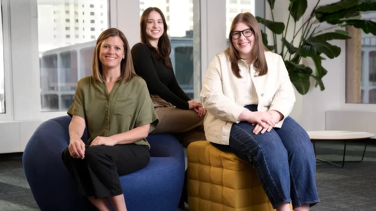 Wpromote colleagues Alison Buchheit, Lexi Hoffman, and Amy Adams seated together in an office