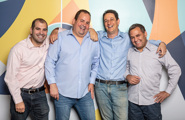 WSC Sports’ four co-founders standing together in their office