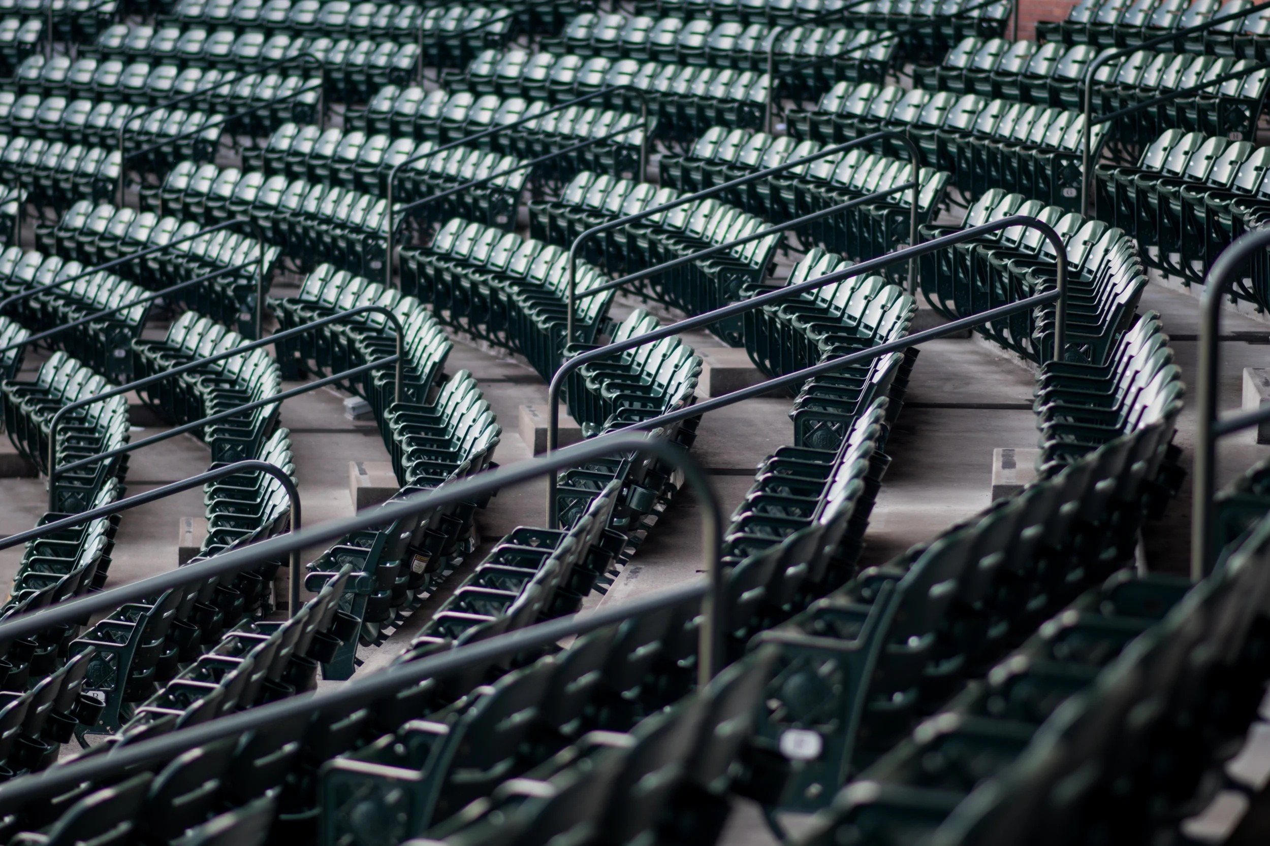 Rows of empty green stadium seats