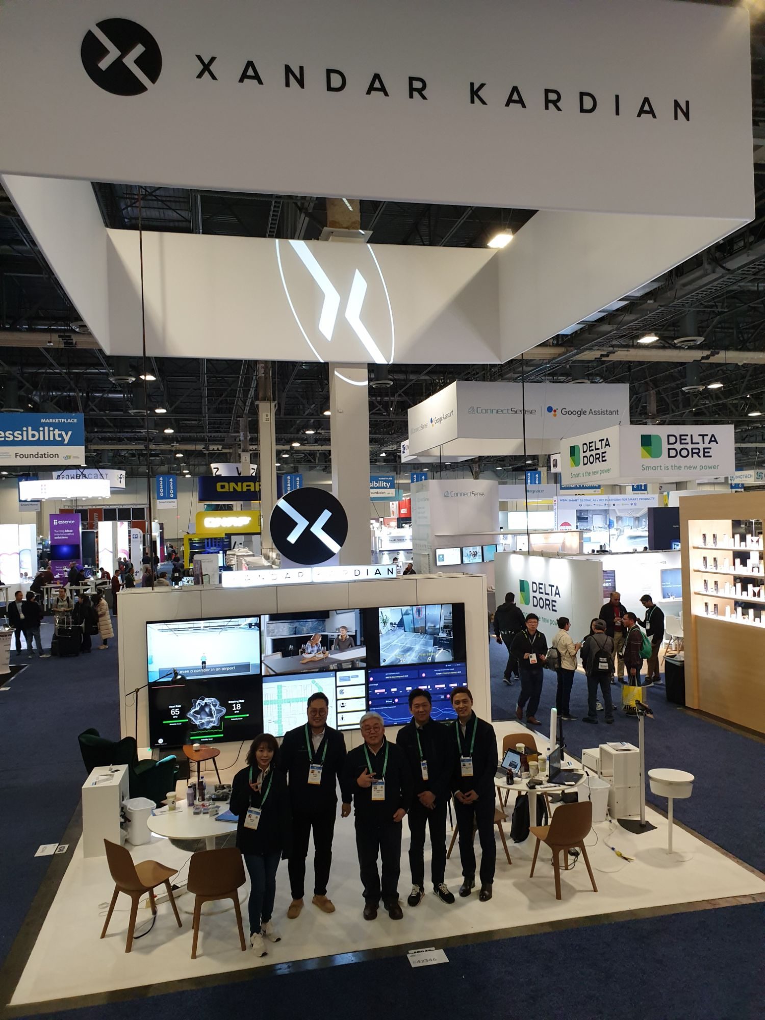 Xandar Kardian team standing beneath its exhibition sign at CES