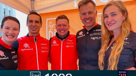 Members of the Pizza Salvatoré 1000 KM team smiling together in branded cycling jerseys