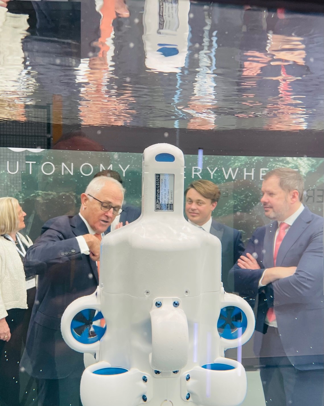 Malcolm Turnbull, Xavier Orr and Ed Husic looking at a Hydrus underwater drone through a demonstration tank