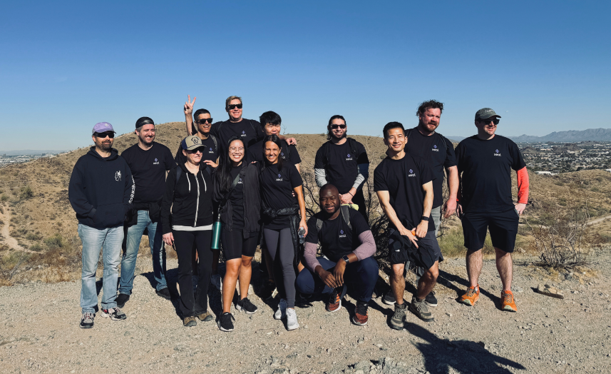 Members of the Xeal team posing together on a desert hike