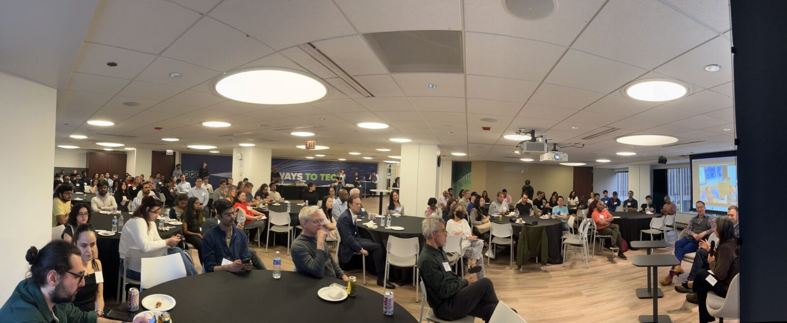 Audience seated around tables at the Tech Pulse 2030 gathering at Discovery Partners Institute in Chicago