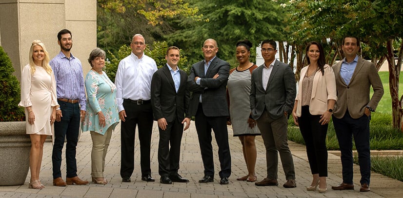 Members of Collins Investment Group, which joined XML Financial Group in 2021, standing together outdoors