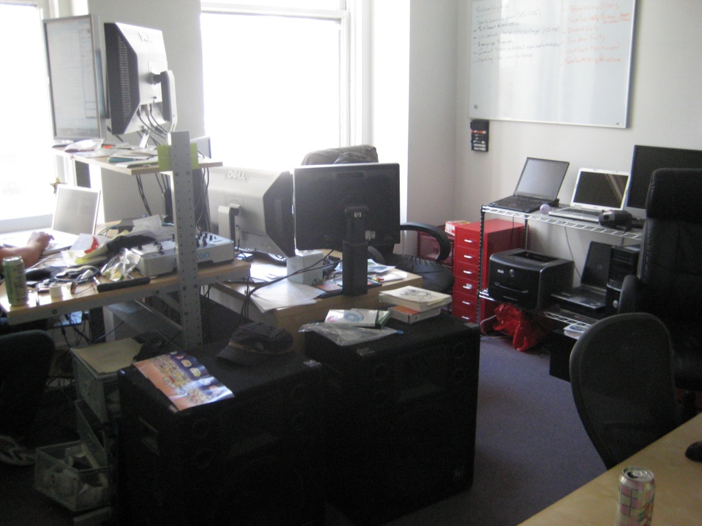 Xobni’s quality assurance workspace in 2008, with multiple monitors, laptops, computers and a whiteboard