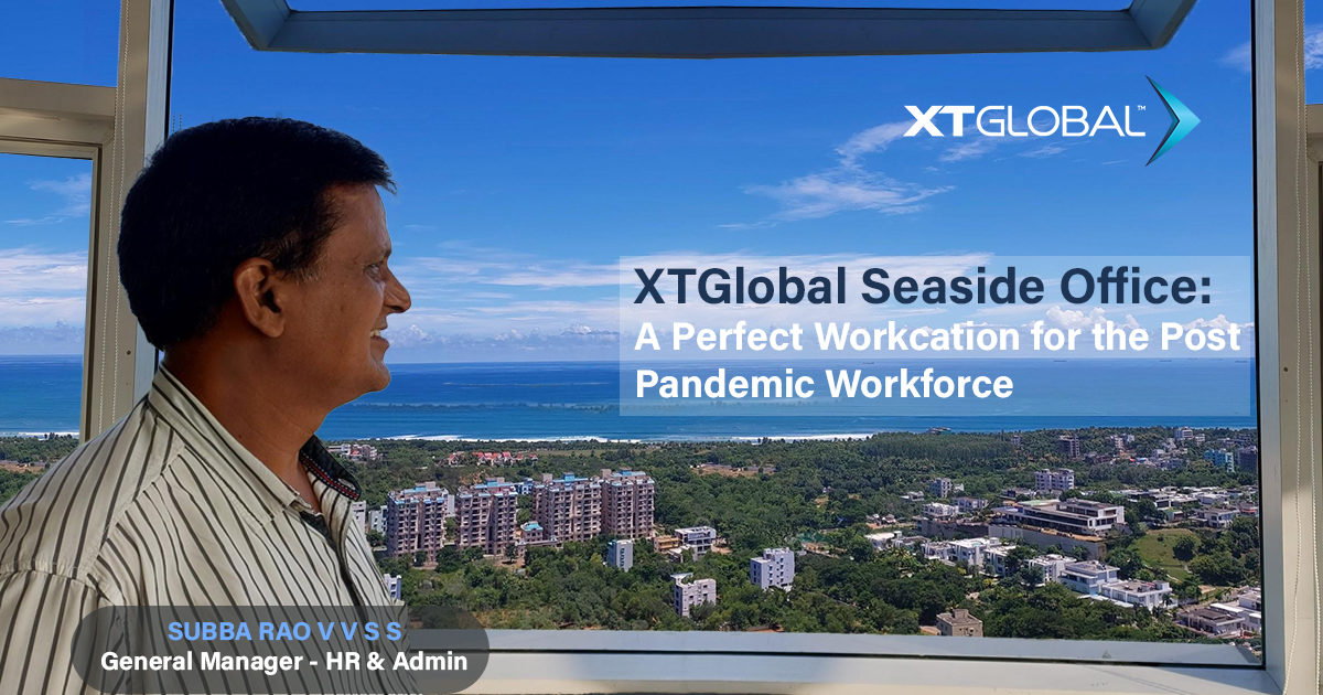 XTGlobal’s published seaside-office image featuring HR and administration leader Subba Rao and a view across Visakhapatnam toward the sea
