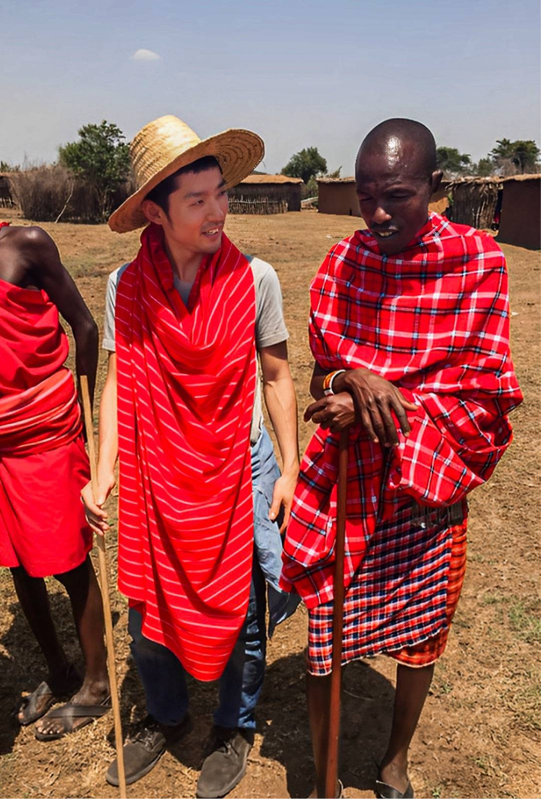Xvolve founder Yuki Mochizuki, at left, with people during his travels