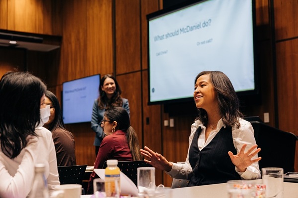 Yasmene McDaniel talking with participants at the GEM and Ivey event