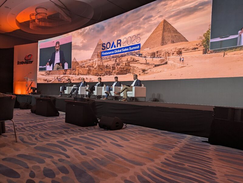 A panel on the stage at Firstsource’s SOAR 2025 Global Sales Summit