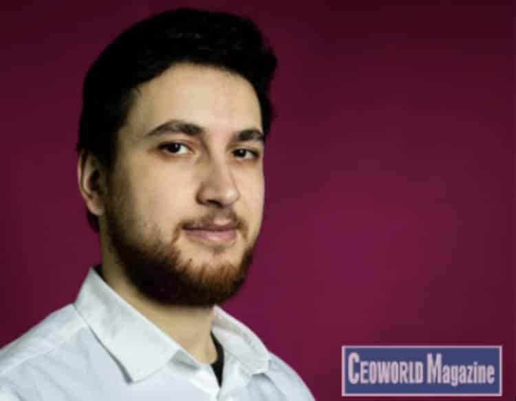 An earlier press portrait of Yazan Sehwail in a light shirt against a burgundy background