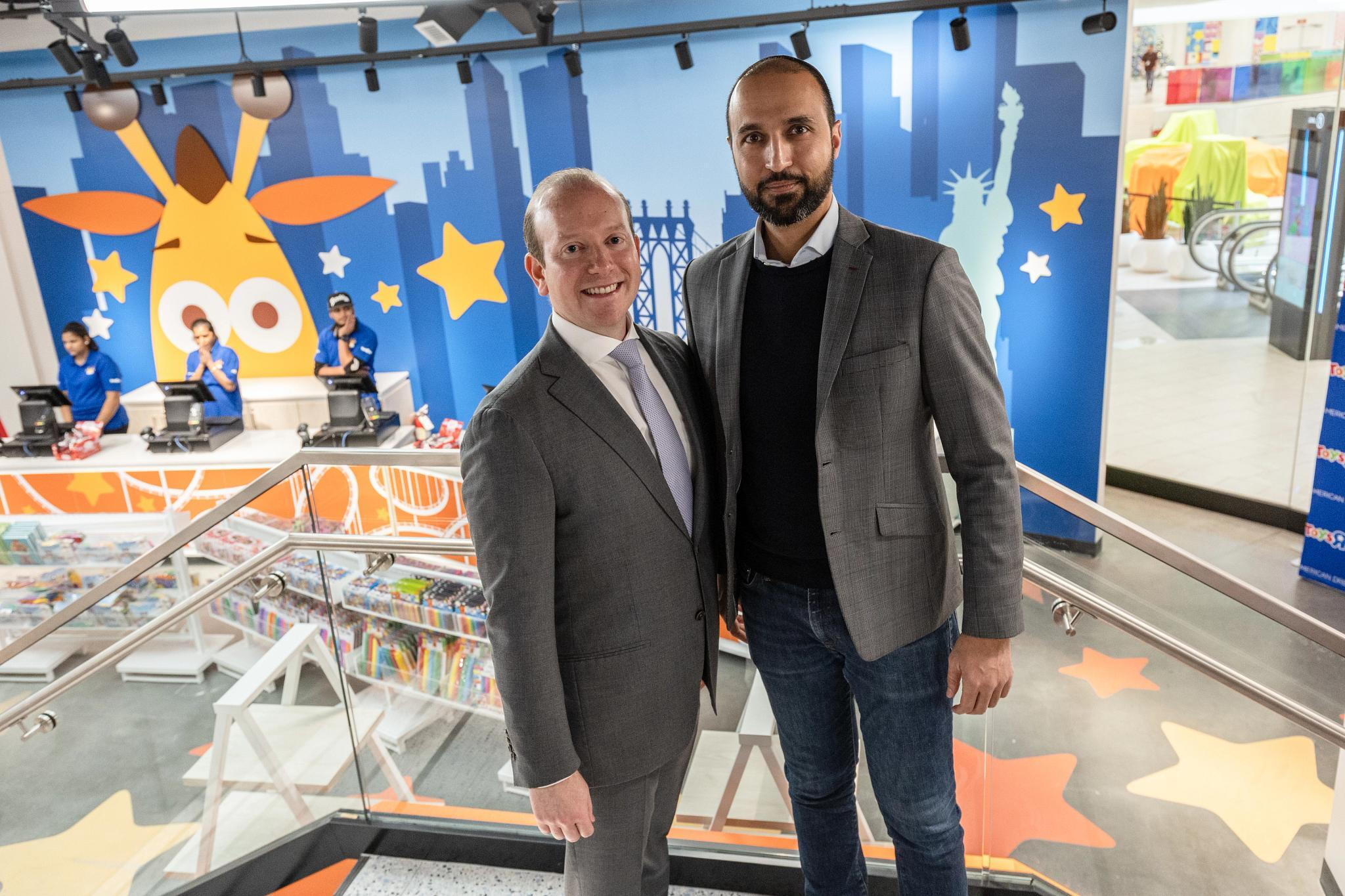 Yehuda Shmidman, left, and Paul Ghermezian at Toys R Us in American Dream, with Geoffrey the Giraffe on the wall behind them.